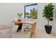 Bright home office with modern desk and large window creates an inspiring and productive workspace at 1323 Loma Linda Ct, Sarasota, FL 34239