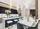 Modern kitchen featuring a large island with seating, pendant lighting, and stainless steel appliances at 1323 Loma Linda Ct, Sarasota, FL 34239