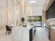 Bright open kitchen with island, quartz countertops and stainless steel appliances at 1323 Loma Linda Ct, Sarasota, FL 34239