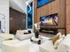 Spacious open-concept living room featuring a fireplace, large windows, and stylish furnishings at 1323 Loma Linda Ct, Sarasota, FL 34239