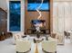 Bright living room with soaring ceilings, fireplace, and modern decor at 1323 Loma Linda Ct, Sarasota, FL 34239