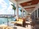 Inviting outdoor seating area with waterfront views, comfortable seating, and a stylish setting for relaxation and dining at 1323 Loma Linda Ct, Sarasota, FL 34239