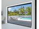 Sliding glass doors lead to a patio with a view of the private pool at 1323 Loma Linda Ct, Sarasota, FL 34239