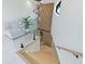Open staircase with wood treads, glass railing, and a modern design with a view of the landing at 1323 Loma Linda Ct, Sarasota, FL 34239