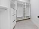 Spacious walk-in closet with built-in shelving and drawers offers ample storage and organization at 1323 Loma Linda Ct, Sarasota, FL 34239