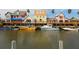 Charming waterfront homes with boats docked, offering a picturesque and relaxed coastal living experience at 1323 Loma Linda Ct, Sarasota, FL 34239