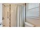 Bathroom with white subway tile in shower and accessible grab bar at 1334 De Prie Rd, Englewood, FL 34223