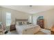 Comfortable bedroom featuring neutral tones, plenty of natural light, and wood furniture at 1334 De Prie Rd, Englewood, FL 34223