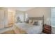Cozy bedroom featuring a comfortable bed with decorative headboard and quaint bedside table with lamp at 1334 De Prie Rd, Englewood, FL 34223