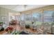 Bright Florida room offering comfortable seating and seamless access to the dining area at 1334 De Prie Rd, Englewood, FL 34223