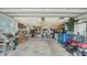 Spacious two-car garage with ample storage space, shelving, and room for vehicles and projects at 1334 De Prie Rd, Englewood, FL 34223