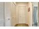 Hallway featuring plenty of closet space for storage and easy access to the nearby bathroom at 1334 De Prie Rd, Englewood, FL 34223