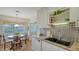 Well-appointed kitchen featuring stainless steel appliances, ample storage, and breakfast nook at 1334 De Prie Rd, Englewood, FL 34223