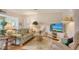 Inviting living room with comfortable seating, wood floors, and ample natural light at 1334 De Prie Rd, Englewood, FL 34223