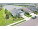 Aerial view showcases a well-maintained property with a pond view and lush landscaping at 13549 Old Creek Ct, Parrish, FL 34219