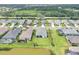 Aerial view showcasing a well-maintained neighborhood with manicured lawns and beautiful single-Gathering homes at 13549 Old Creek Ct, Parrish, FL 34219