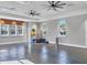Bright fitness center featuring updated equipment, ceiling fans, and ample natural light from large windows at 13549 Old Creek Ct, Parrish, FL 34219