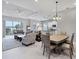This inviting living space is open to the dining area and kitchen, perfect for entertaining and relaxation at 13549 Old Creek Ct, Parrish, FL 34219