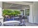 Inviting outdoor patio area with comfortable seating and an elegant outdoor dining area at 13549 Old Creek Ct, Parrish, FL 34219