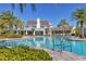 Stunning community pool with a luxurious clubhouse and well-manicured landscaping at 13549 Old Creek Ct, Parrish, FL 34219