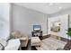 Inviting space features comfortable seating, dark hardwood floors and flows seamlessly into the main living areas at 13549 Old Creek Ct, Parrish, FL 34219
