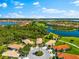 Stunning aerial view of the community, highlighting beautiful homes surrounded by lakes and nature at 138 Tiziano Way, North Venice, FL 34275