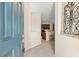 View from the front door showing the tiled foyer, open to the kitchen and main living area at 138 Tiziano Way, North Venice, FL 34275