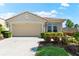 Charming single-story home with manicured landscaping and a two-car garage at 138 Tiziano Way, North Venice, FL 34275