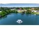 Aerial view showcases a community pool, lake, and recreational areas at 1409 57Th W St # 1409, Bradenton, FL 34209