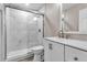 Modern bathroom with a glass-enclosed shower, white vanity, contemporary fixtures, and neutral color palette at 1409 57Th W St # 1409, Bradenton, FL 34209
