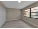 Bedroom with wood-look flooring, closet and window at 1409 57Th W St # 1409, Bradenton, FL 34209
