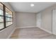 Bright bedroom featuring wood-look floors, closet, neutral paint, and a window allowing natural light at 1409 57Th W St # 1409, Bradenton, FL 34209