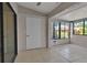 Bonus room has sliding glass windows, tile flooring and a closet at 1409 57Th W St # 1409, Bradenton, FL 34209