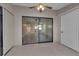 Bonus room features tile flooring, sliding glass doors and windows at 1409 57Th W St # 1409, Bradenton, FL 34209