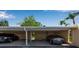 Carport with parking for two cars, showing painted support beams at 1409 57Th W St # 1409, Bradenton, FL 34209