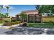 Attractive clubhouse with well-maintained landscaping and inviting entrance at 1409 57Th W St # 1409, Bradenton, FL 34209