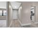 Inviting hallway with light wood floors leads to the kitchen and living areas at 1409 57Th W St # 1409, Bradenton, FL 34209