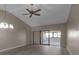 Bright living room with neutral walls, wood-look flooring, and a sliding glass door to the screened patio, great for relaxing at 1409 57Th W St # 1409, Bradenton, FL 34209