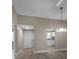 Bright and airy living space features modern chandelier and light-colored wood flooring at 1409 57Th W St # 1409, Bradenton, FL 34209