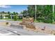 MeadowCroft community signage with landscaped base on a sunny day at 1409 57Th W St # 1409, Bradenton, FL 34209