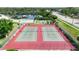 Aerial view of the community's well-maintained tennis courts, highlighting the active lifestyle amenities available to residents at 1409 57Th W St # 1409, Bradenton, FL 34209