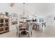Dining room area featuring a round table, chandelier, and view into kitchen at 14257 Heritage Landing Blvd # 1122, Punta Gorda, FL 33955