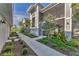 Exterior view of home showcasing sidewalk and well-maintained landscaping at 14257 Heritage Landing Blvd # 1122, Punta Gorda, FL 33955