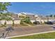 Townhome exterior featuring attached garages, well-maintained landscaping, and a paved driveway at 14257 Heritage Landing Blvd # 1122, Punta Gorda, FL 33955