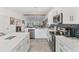 Bright kitchen with island, stainless steel appliances, and modern finishes at 14257 Heritage Landing Blvd # 1122, Punta Gorda, FL 33955