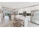Open-concept kitchen featuring stainless steel appliances, white cabinets, and an island with seating at 14257 Heritage Landing Blvd # 1122, Punta Gorda, FL 33955
