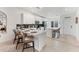 Kitchen features an open concept with black backsplash and white cabinets at 14257 Heritage Landing Blvd # 1122, Punta Gorda, FL 33955