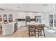 Bright kitchen featuring stainless appliances, an island with seating, and sliding glass door at 14257 Heritage Landing Blvd # 1122, Punta Gorda, FL 33955