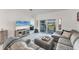 Comfortable living room featuring a large sectional sofa and access to the outdoors at 14257 Heritage Landing Blvd # 1122, Punta Gorda, FL 33955