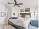 Main bedroom featuring a luxurious king-size bed and access to ensuite bathroom at 14257 Heritage Landing Blvd # 1122, Punta Gorda, FL 33955